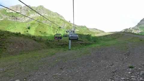 Slow motion Descent on a cable car. View from the ski lift in the mountains to Video stock 188268799