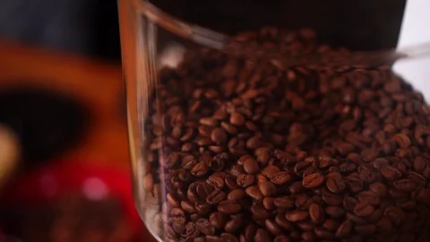 Slow motion detailed close up view on roasted coffee beans arabica robusta in Stock Footage 104372770