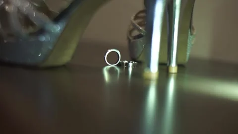 Slow Motion Detailed Shot of Pair of Wedding Rings with Bridal Essentials Stock Footage 341103254