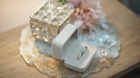 Slow Motion Detailed Shot of Pair of Wedding Rings with Bridal Essentials Stock Footage 341979234