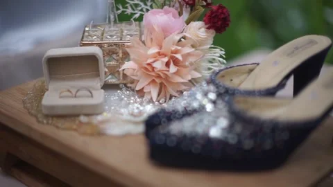 Slow Motion Detailed Shot of Pair of Wedding Rings with Bridal Essentials Stock Footage 341979431