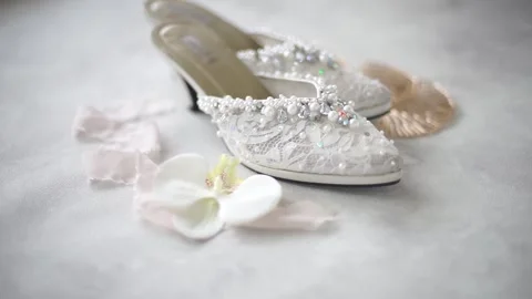 Slow Motion Detailed Shot of Pair of Wedding Rings with Bridal Essentials Stock Footage 342082552