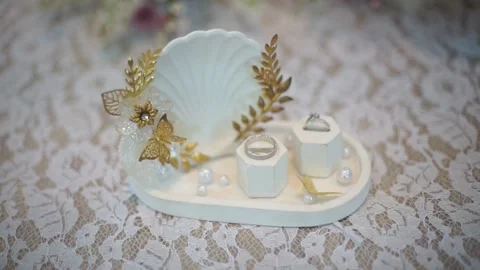 Slow Motion Detailed Shot of Pair of Wedding Rings with Bridal Essentials Stock Footage 342083698