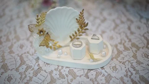 Slow Motion Detailed Shot of Pair of Wedding Rings with Bridal Essentials Stock Footage 342086477