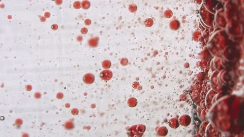 Slow motion diffusion of red particles in colorless liquid Stock Footage 132188660