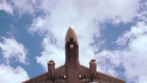 Slow Motion - Direct underneath airplane landing Stock Footage 94431702
