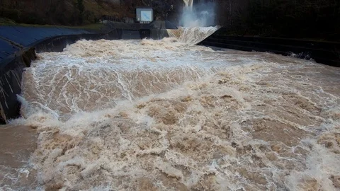 Slow motion dirty brown raging turbulent flood water Stock Footage 122205548