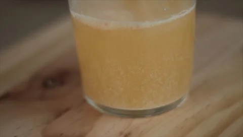 Slow Motion Dissolution: Closeup of Tablets Dissolving in Glass of Water Vidéo 241397596