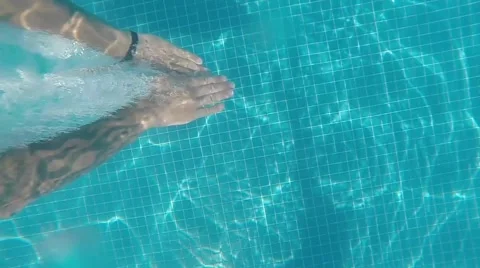 Slow motion dive into a pool. Man with tattoos Stock Footage 45339508