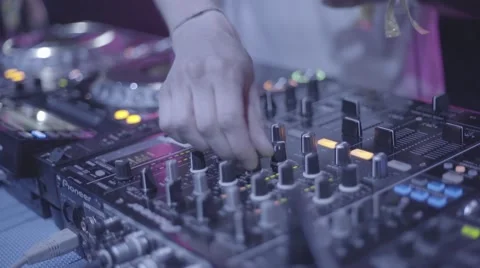 Slow motion dj plays with the cd disc recorder at a party at summer Stock Footage 54220716