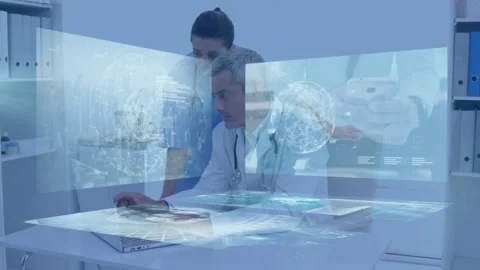In slow motion, the doctor is using the computer keyboard at the desk in the Stock Footage 330051874
