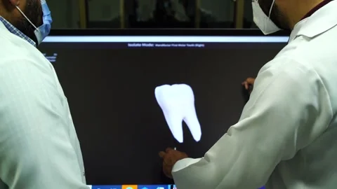 Slow motion of doctors teaching human teeth on vertual screen 1 Stock Footage 199272060