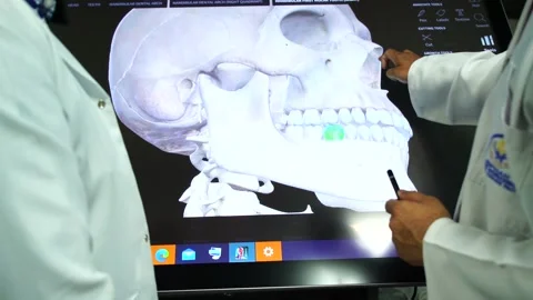 Slow motion of doctors teaching human teeth on vertual screen 3 Stock Footage 199272083
