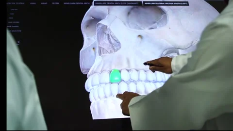 Slow motion of doctors teaching human teeth on vertual screen5 Stock Footage 199272220