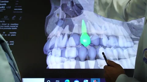 Slow motion of doctors teaching human teeth on vertual screen6 Stock Footage 199272258