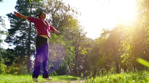 Slow Motion of Doing Exercise In the Nature Stock Footage 56428212