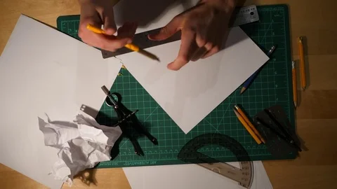 Slow Motion doing Math and Drawing Lines on a desk Видео 76222720