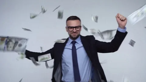 Slow motion of dollars falling on formally dressed man Stock Footage 82718799