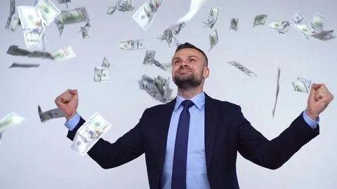 Slow motion of dollars falling on formally dressed man Stock Footage 83140493