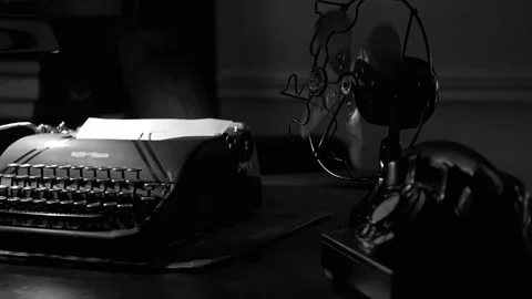 Slow motion dolly around a 1940s typewriter and fan Stock Footage 165614679