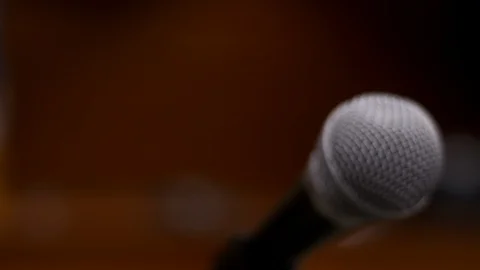 Slow motion dolly close-up shot of courtroom microphone Stock Footage 85576201