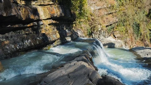Slow Motion Dolly In: Moving Towards the Edge of a Forest Waterfall Stock Footage 270458800