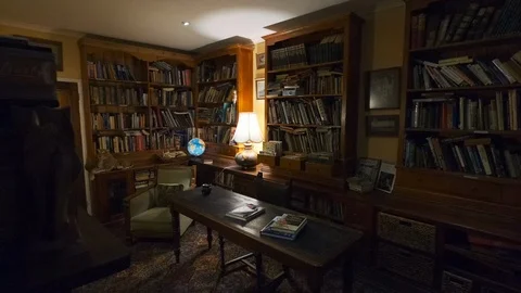Slow motion dolly style dark indoor shot of a antique library interior and Video stock 110690077