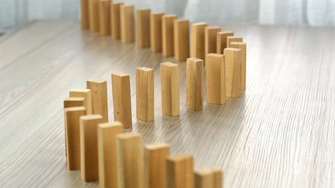 Slow motion domino effect strategy and planning Stock Footage 103992278