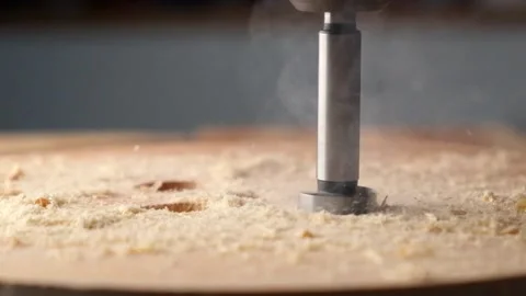 Slow motion of a drill bit drilling into the wood Stock Footage 194119663