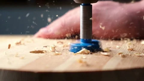 Slow motion of a drill bit drilling into the wood Stock Footage 194827984