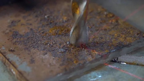 Slow motion drill bit processes metal workpiece on drilling machine Stock Footage 118085891