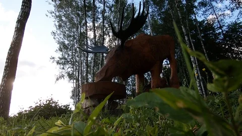 Slow motion of drinking moose sculpture in a park. Stock Footage 112799453