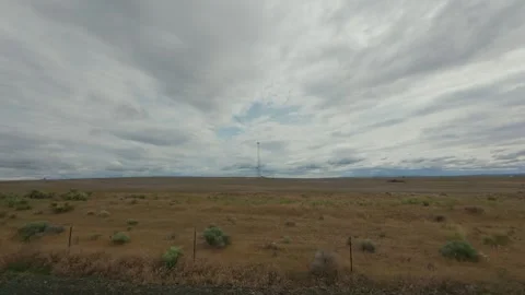 Slow Motion Drive Past a Cell Tower in Eastern Oregon Stock Footage 316846289