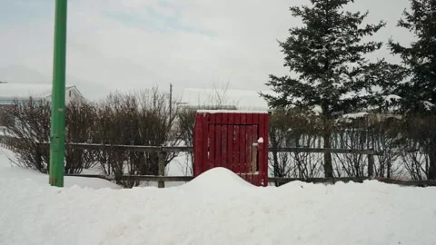 Slow motion drive by shot of small low income homes on an indigenous reserve Video stock 300334799