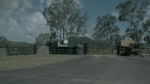 Slow Motion Drive Through Rural Gate in Sunshine Coast Hinterland Queensland Aus Stock Footage 341297245