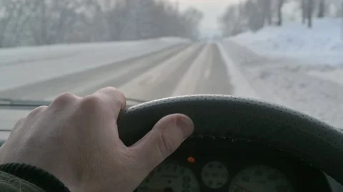 Slow motion. The driver's hand is on the steering wheel inside the car Stock Footage 201363396