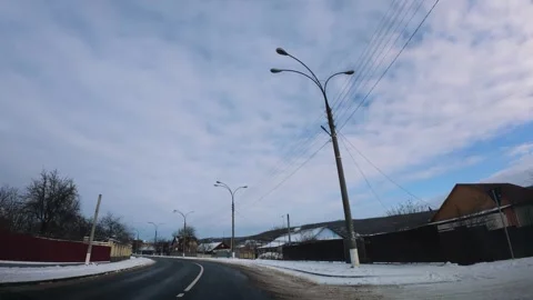 Slow Motion Driving on Empty Asphalt Road Through Winter Village Stock Footage 326962020