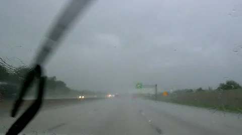 Slow motion driving on rainy U.S. highway Stock Footage 54893509