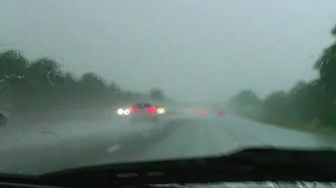 Slow motion driving on rainy U.S. highway Stock Footage 54919014