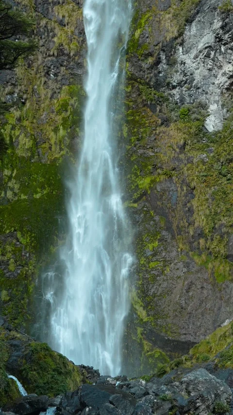 Slow motion drone of Devils Punchbowl waterfall dropping from cliff Stock Footage 310767914