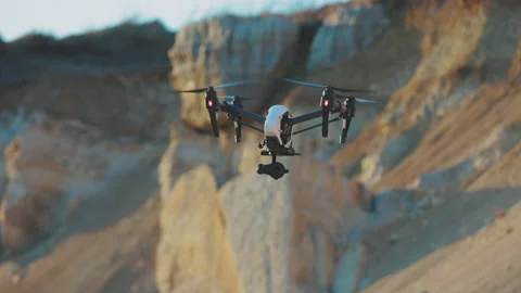 Slow motion drone flies on background rock. Modern technologies for shooting Stock Footage 175400052