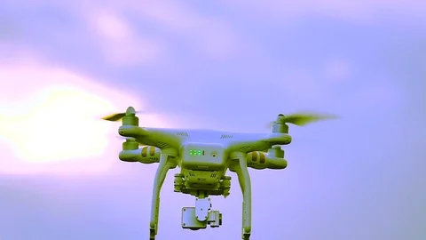 Slow motion. Drone fly away in  front of blue sky. Modern technologies Video stock 76219111
