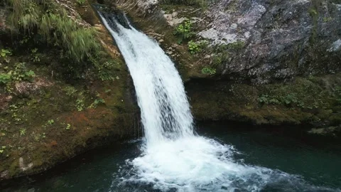 Slow motion drone fly-away from Blue Eye Kaprre waterfall Albania Stock-Footage 342437457