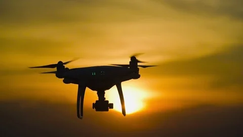 Slow motion : drone flying over on sunset. drone moving in to the sun. 動画素材 76461304