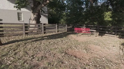 Slow motion drone hover over dog agility table and training equipment Stock Footage 346732125
