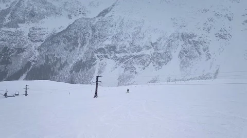 Slow motion. Drone shooting. Top view of a lone snowboarder going down the Stock Footage 166092930