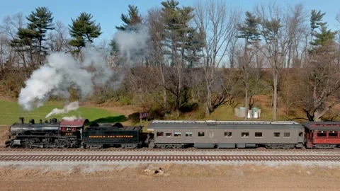 Slow Motion Drone Side View of an Antique Steam Passenger Train, Approachin.. Stock Footage 238655137