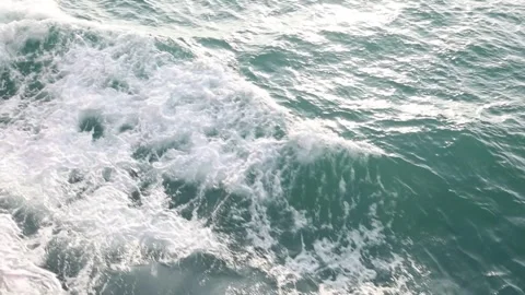 Slow motion drone video of aerial view of the ocean waves splashing Stock Footage 343479911