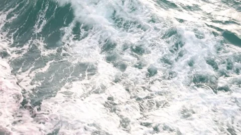 Slow motion drone video of aerial view of and ocean with waves Stock Footage 343820836