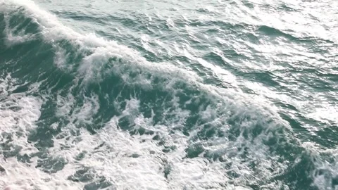 Slow motion drone video of aerial view of the ocean waves splashing Stock Footage 343825372